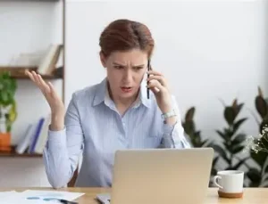 Disappointed customer at counter or negative online review on screen